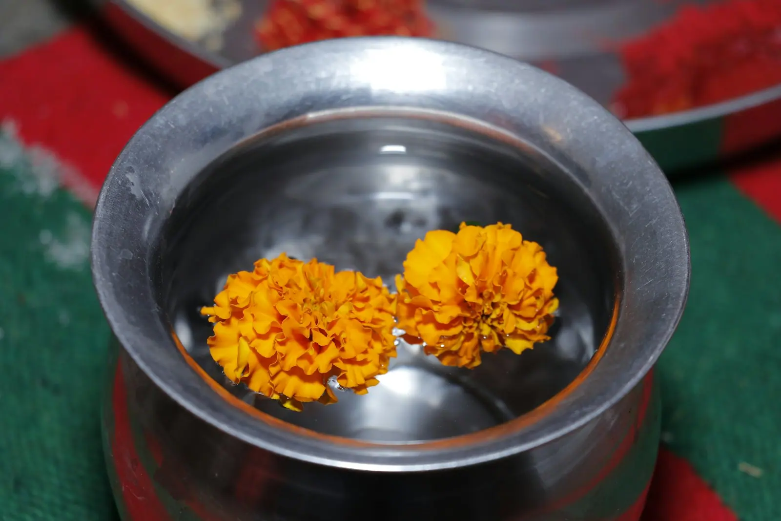 Flower petals floating in a bowl of water