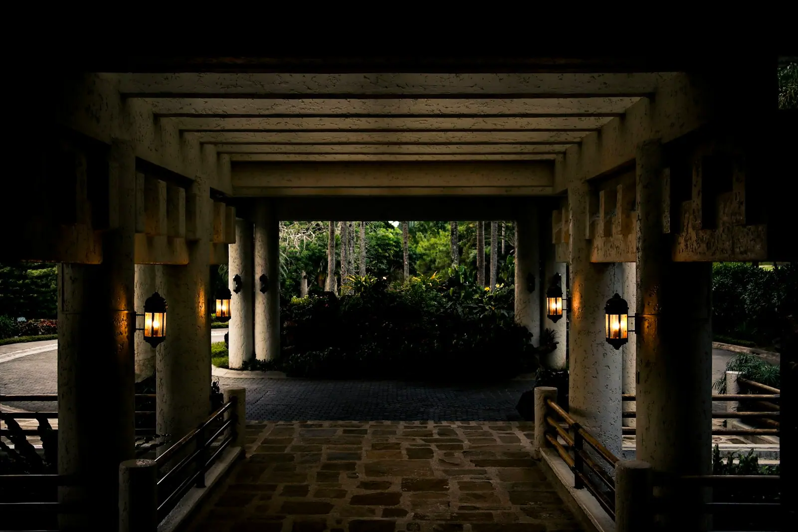 A garden walkway lit at dusk