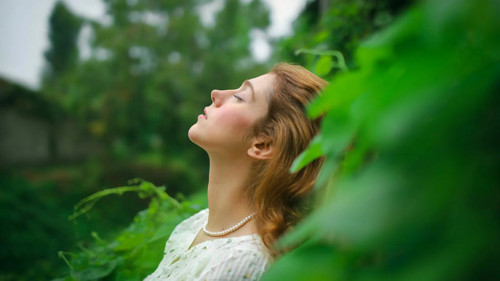 A person breathing calmly outdoors