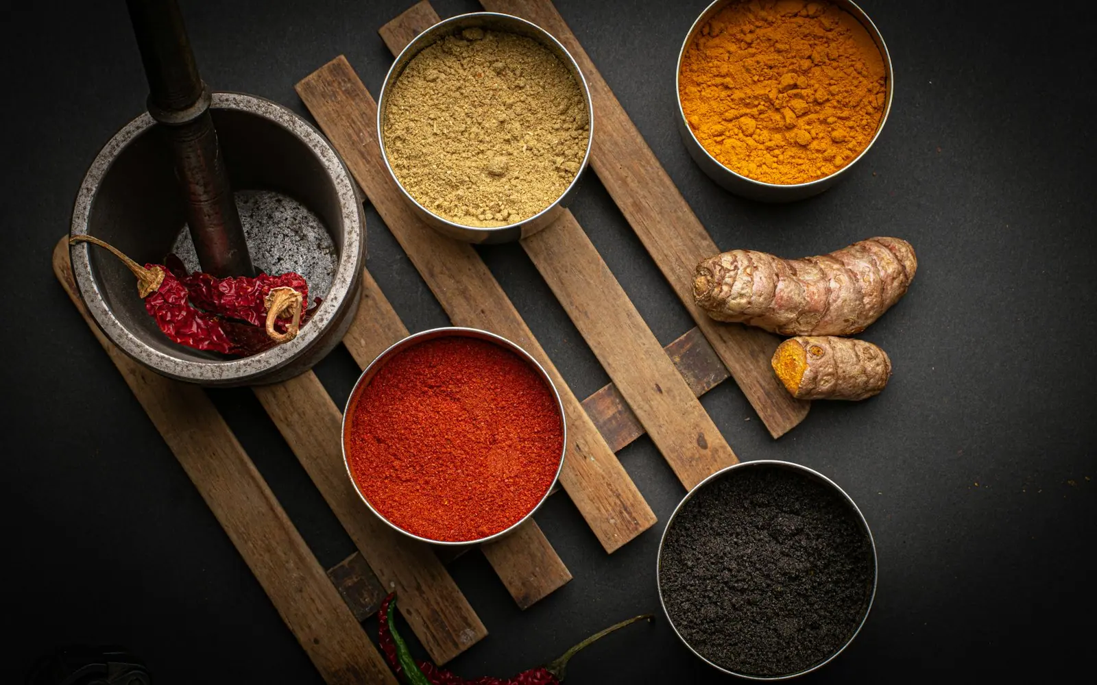 Ayurvedic herbs and powders in small bowls