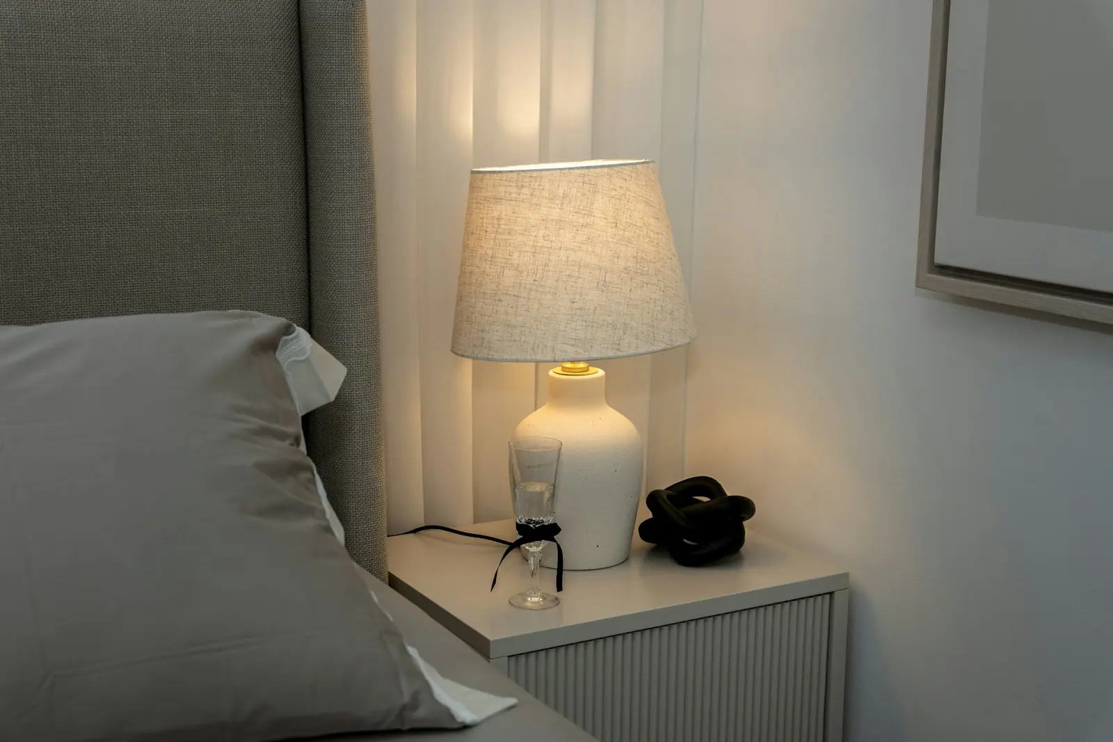 A softly lit bedroom in the evening