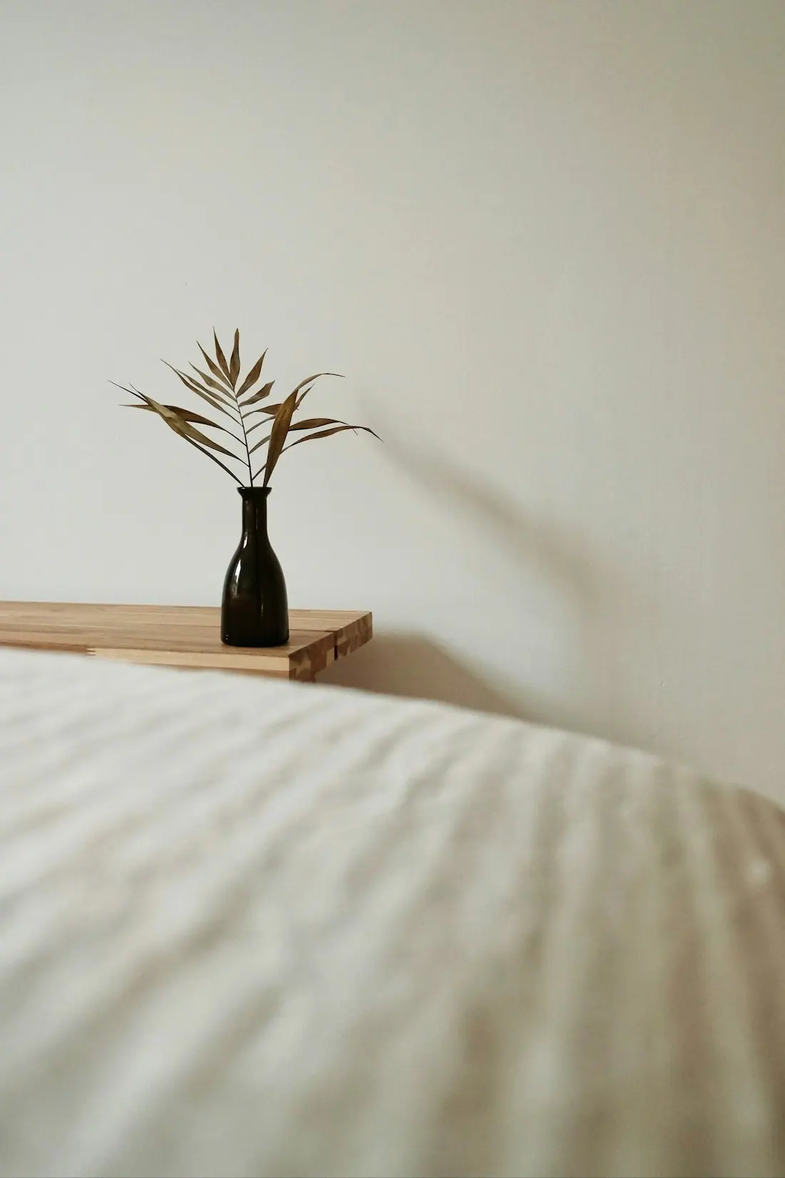Morning light falling across linen bedding