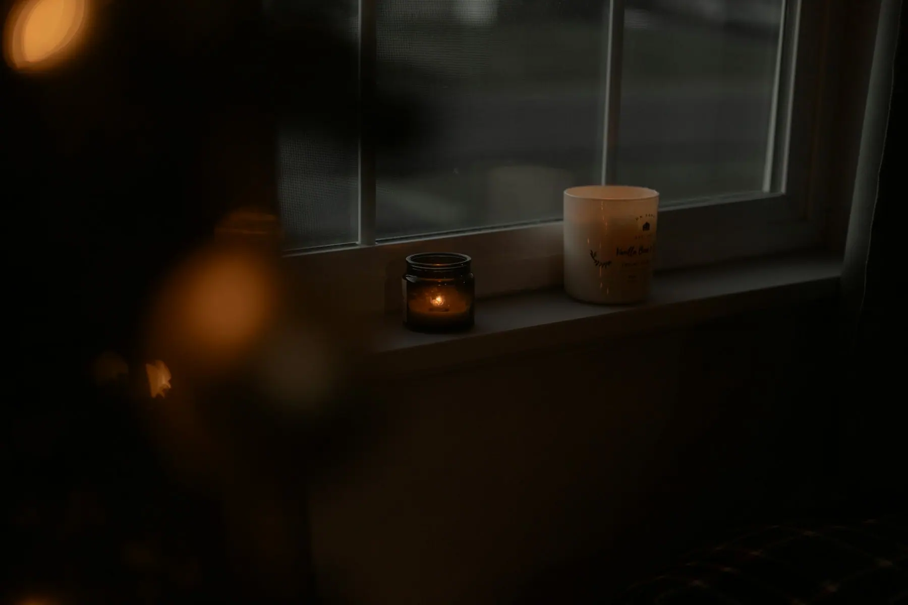 Candlelight in a warm, calm room at dusk