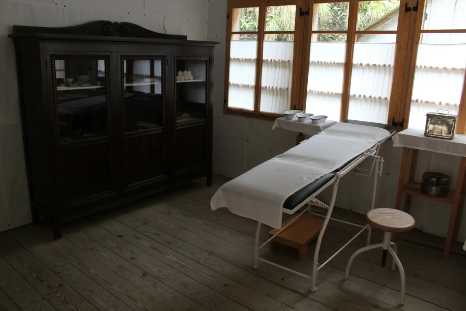 A traditional wooden Ayurvedic treatment table